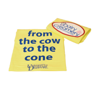 A photo of a youth t-shirt for the UDairy Creamery with the slogan "From the cow to the cone."