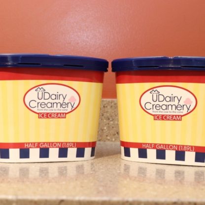 A photo of two half gallon UDairy Creamery ice cream containers